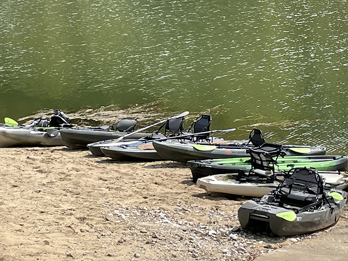 kayaks on the edge of a lake