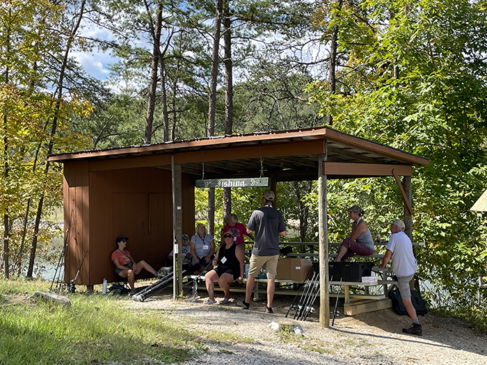 People getting instruction under a structure