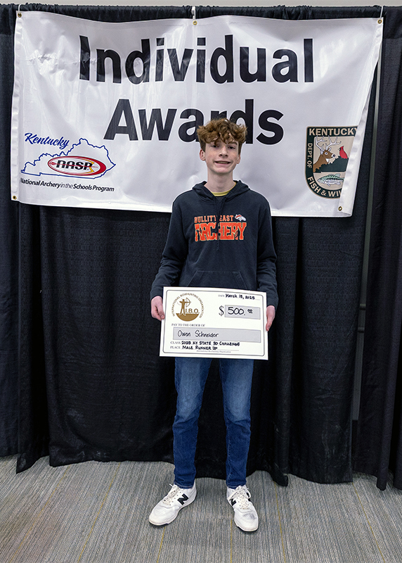 a students holding up a certificate in from a sign that reads individual awards