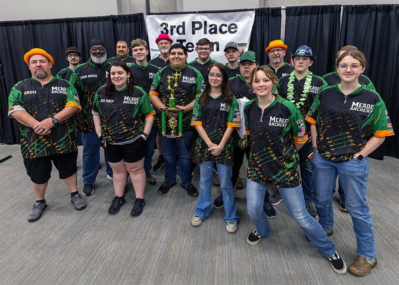 A massive group of students and adults in front of a sign that reads 3rd place team