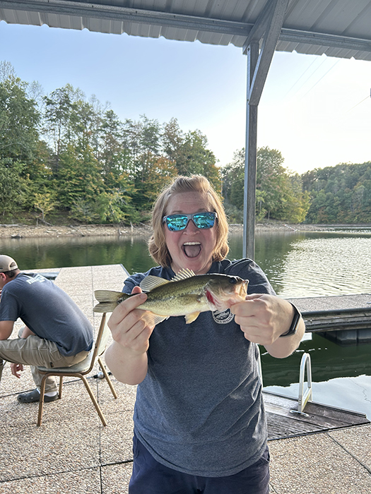 Megan O holding up a smallmouth bass