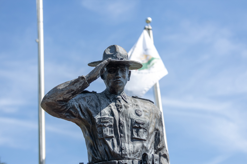 A statue of a conservation officer in salute