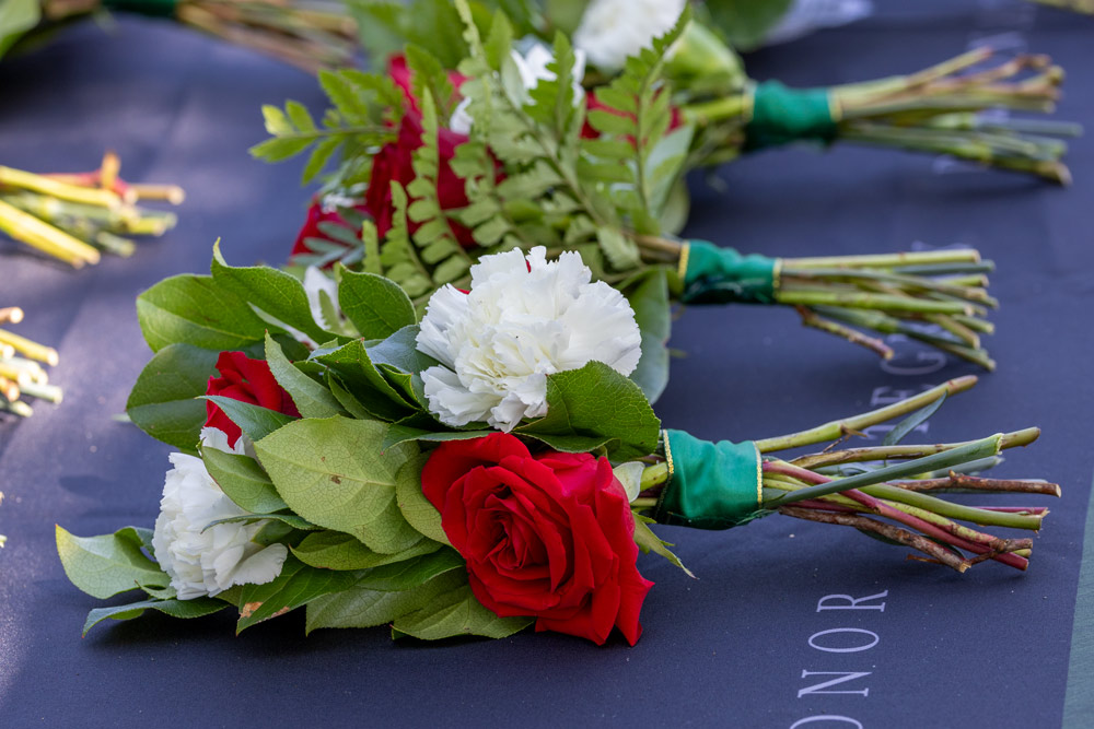 Flower arrangements are resting on a table