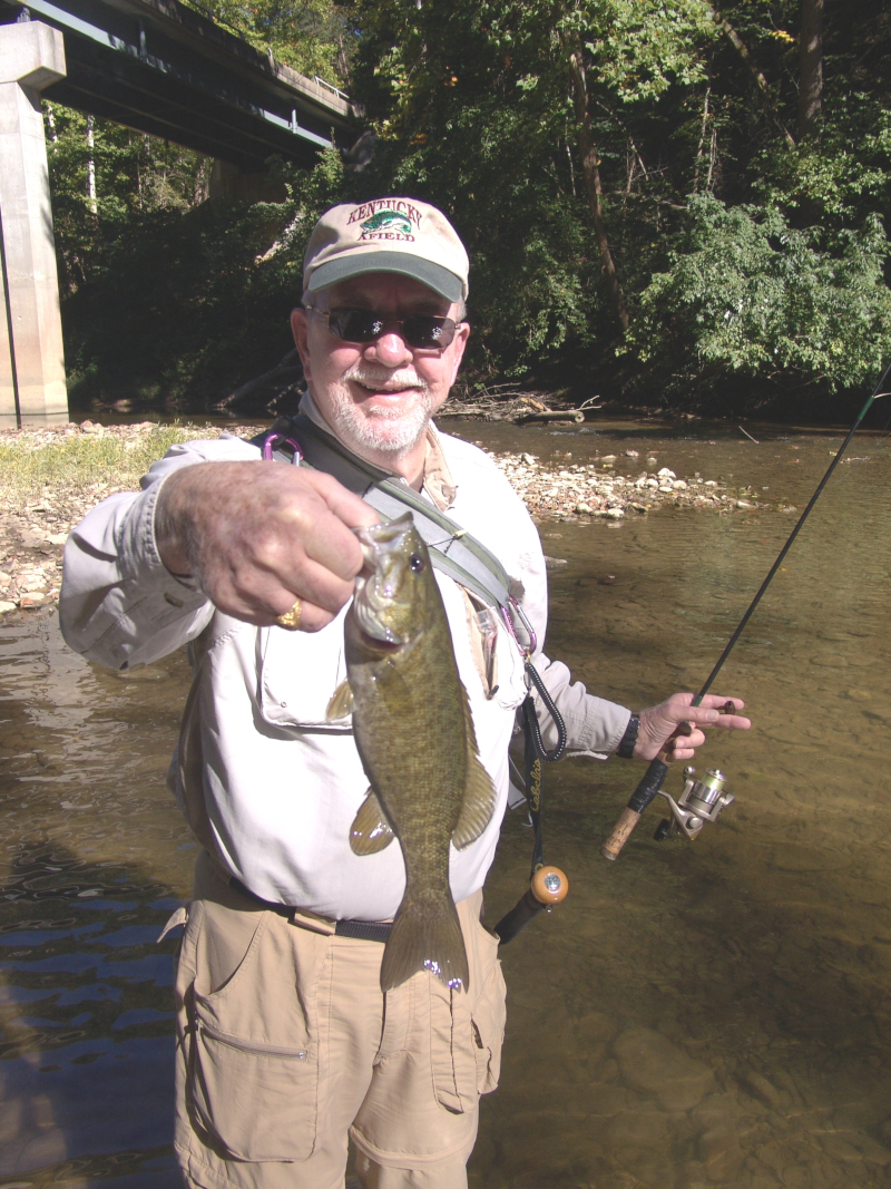 Dr. Larry Kelley holds a smallmouth bass caught from Pulaski County's Buck Creek