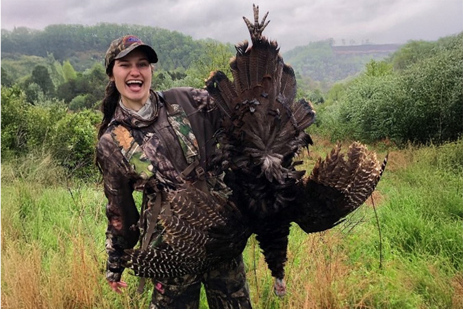 hunter holding up turkey