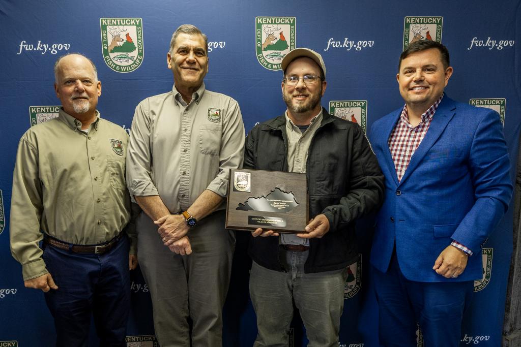 Pictured left to right Fisheries Division Assistant Director Jeff Ross, Fisheries Division Director Dave Dreves, David Baker, and Commissioner Rich Storm.