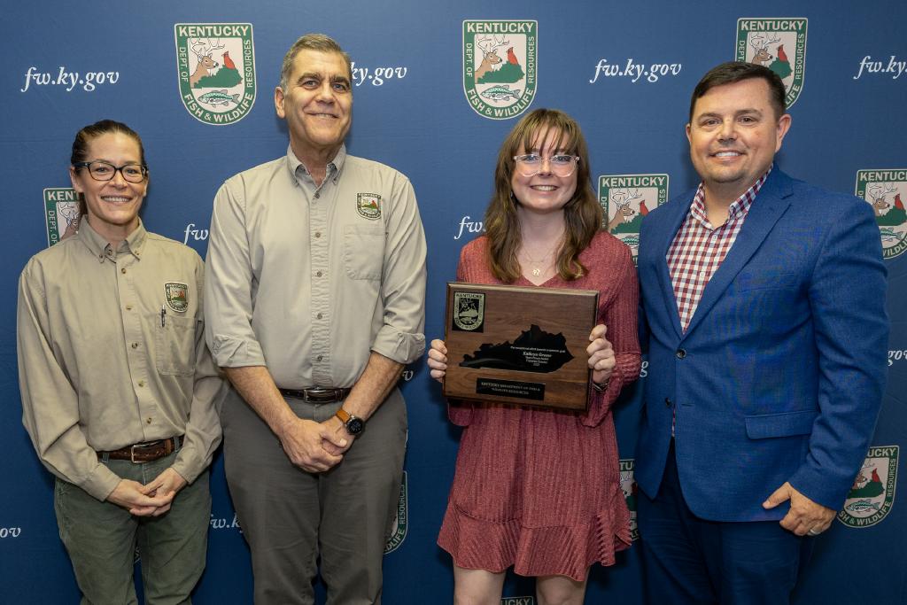 Pictured left to right Fisheries Division Environmental Scientist Kristy Stroud, Fisheries Division Director Dave Dreves, Kathryn Greene, and Commissioner Rich Storm.