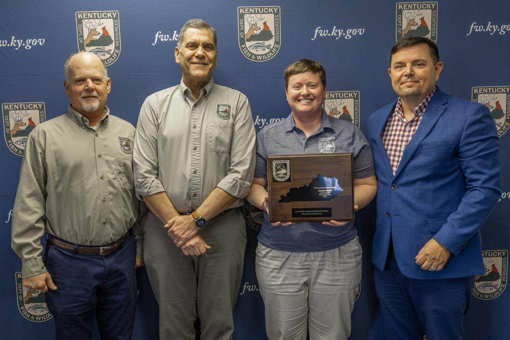 Pictured left to right Fisheries Division Assistant Director Jeff Ross, Fisheries Division Director Dave Dreves, Maddy Ruble, and Commissioner Rich Storm