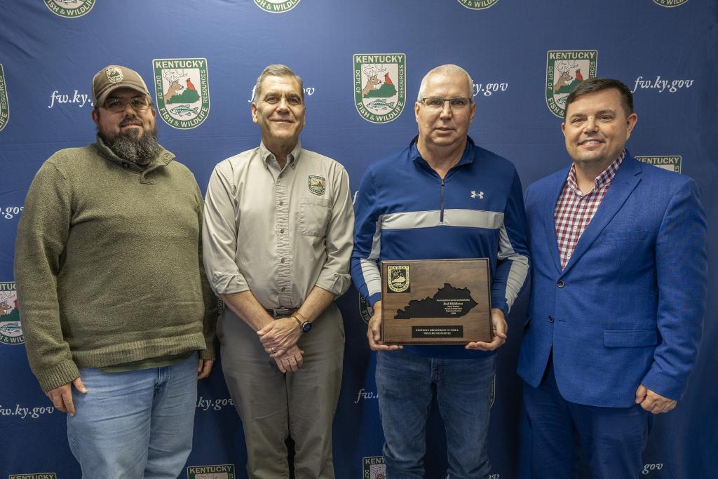 Pictured left to right Fisheries Division Assistant Director Josh Pennington, Fisheries Division Director Dave Dreves, Rod Middleton, and Commissioner Rich Storm.