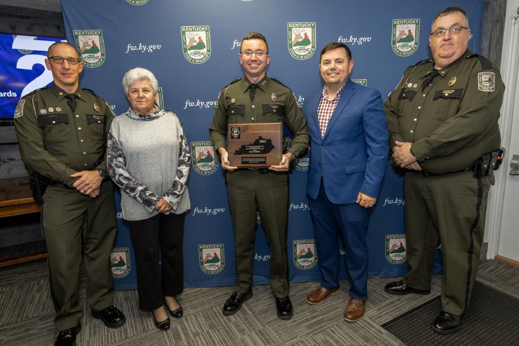 Pictured left to right Law Enforcement Division Assistant Director Maj. David Marques, United Bow Hunters of Kentucky representative Judy Roberts, Ofc. Dylan Martin, Commissioner Rich Storm, and Law Enforcement Division Assistant Director Maj. Greg Watts.