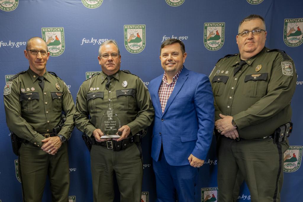 Pictured left to right Law Enforcement Division Assistant Director Maj. David Marques, Ofc. Greg Youree, Commissioner Rich Storm, and Law Enforcement Division Assistant Director Maj. Greg Watts.