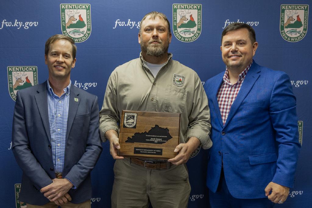 Pictured left to right Wildlife Division Director Ben Robinson, Jacob Stewart, and Commissioner Rich Storm.