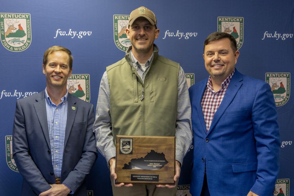 Pictured left to right Wildlife Division Director Ben Robinson, John Zimmer, and Commissioner Rich Storm.