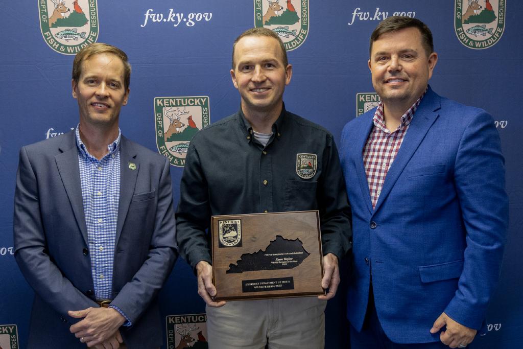 Pictured left to right Wildlife Division Director Ben Robinson, Ryan Taylor, and Commissioner Rich Storm.