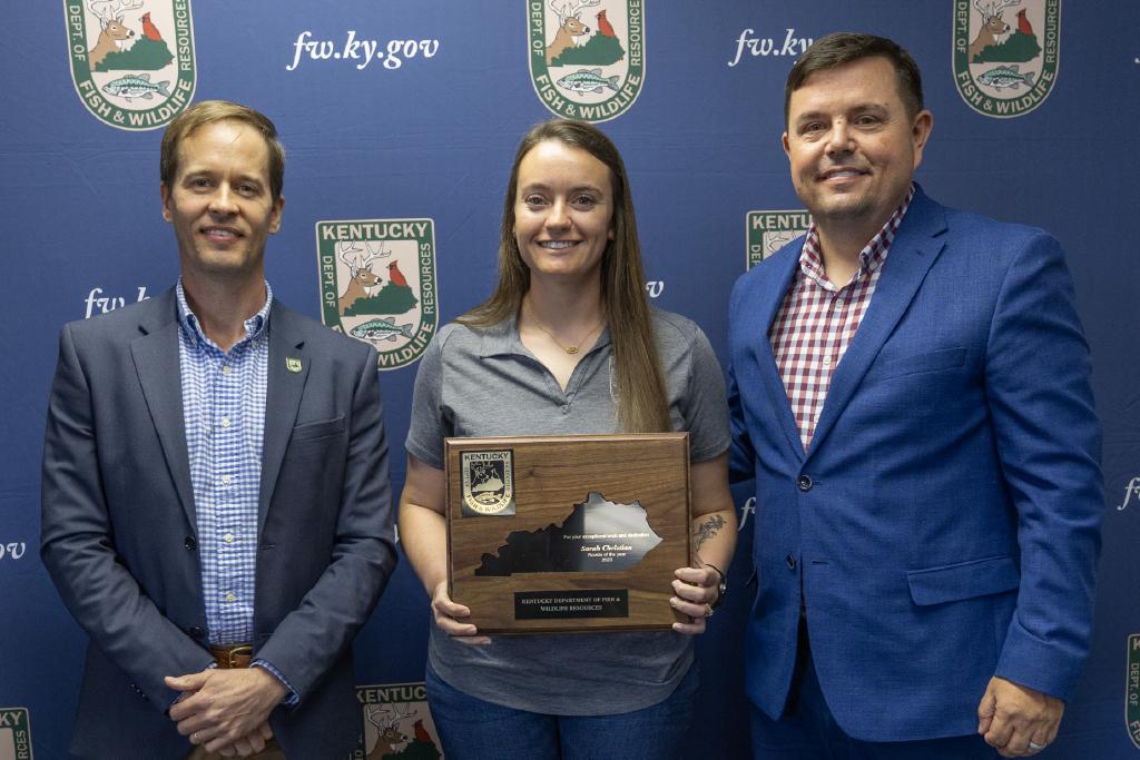 Pictured left to right Wildlife Division Director Ben Robinson, Sarah Christian, and Commissioner Rich Storm.